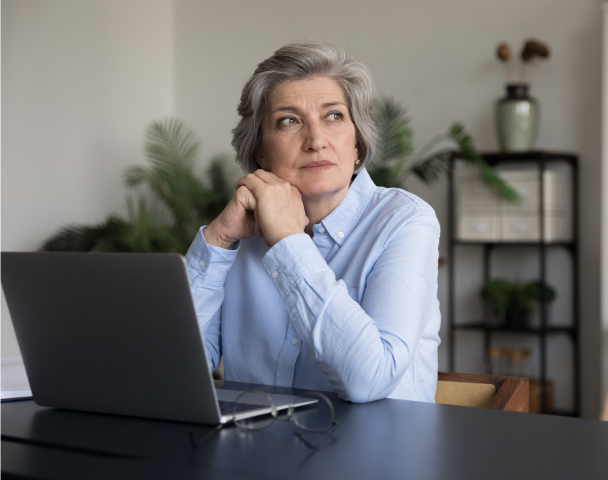 Older woman thoughtfully considering an Immediate Benefit Account for life insurance proceeds from Protective.