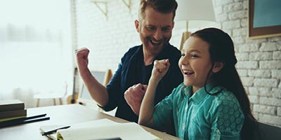 Father and daughter laughing, father wonders if he has made beneficiary mistakes on his life insurance policy