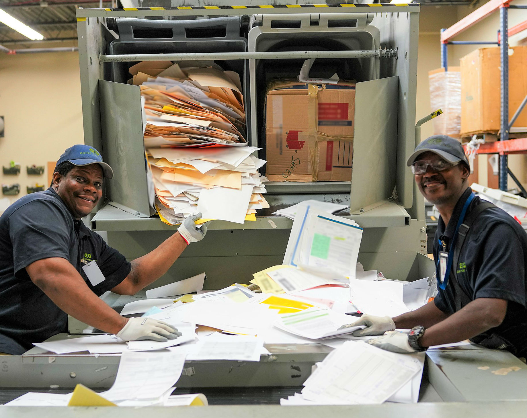 Gone for Good workers shred documents