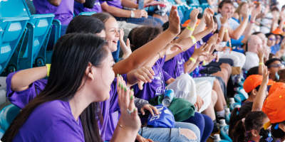 Kids express excitement as they watch a match at the Miami Open.