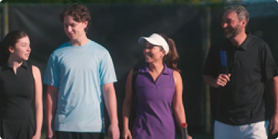 Family heads to the tennis court.