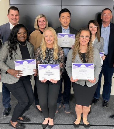 Protective teammates celebrating their completion of the Innovation Fellowship program.