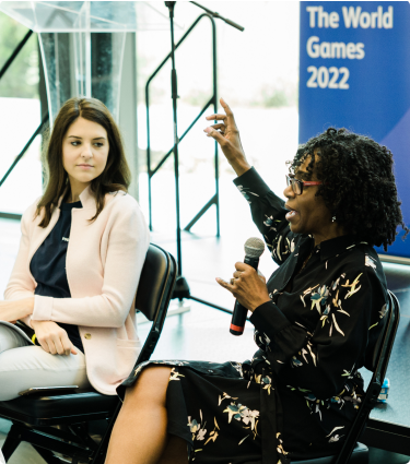 Two women presenting to students at Protective's Leadership Academy.