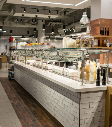 Cafeteria, dining area and coffee shop available for employees at Protective Life office.