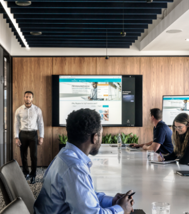 Protective teammates work together in a large conference room