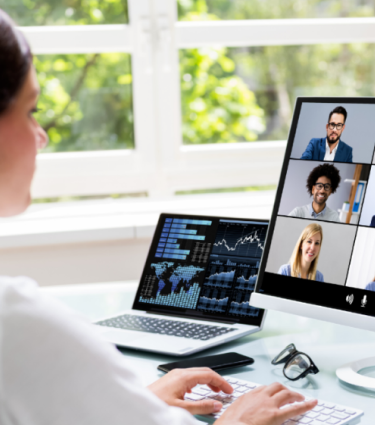 A virtual teammate working in her home office.