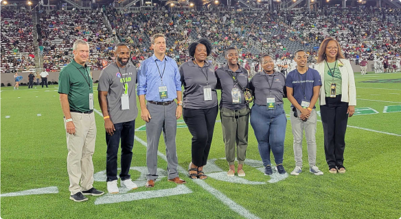 Most Valuable Protectors pose for a picture at a UAB home football game.
