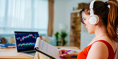 Millennial woman reviewing her financial portfolio's performance