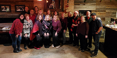 Group of smiling Protective employees at holiday party