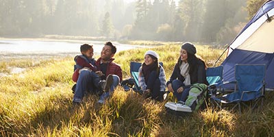  Family enjoying a camping trip thanks to their RV asset protection insurance. 