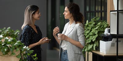 Female client speaking to her financial advisor and discussing policy options.