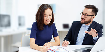 A man discussing the options of tapping into his permanent life insurance policy with his financial advisor. 