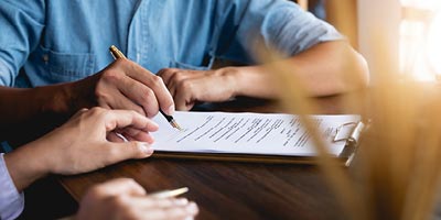 A financial advisor working with their client to choose the best type of life insurance for their needs.