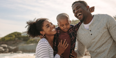 Happy family of three enjoying quality time outdoors.