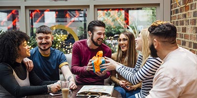 A group of young adult friends celebrating a birthday