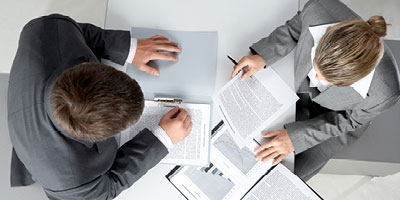 A man and woman review important documents together