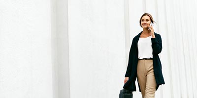 woman walking while talking on the phone