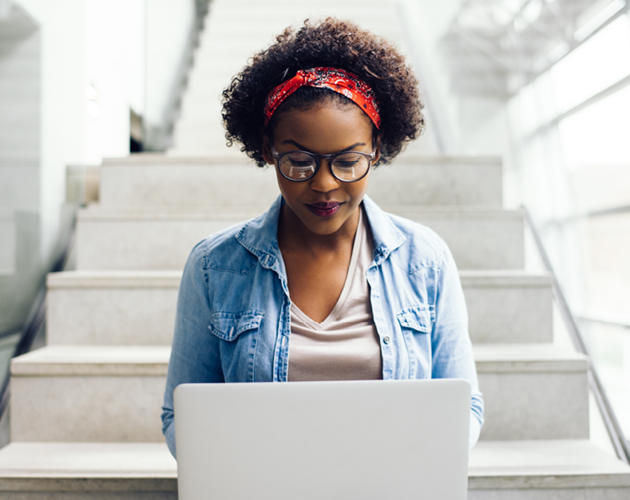 Young woman using laptop.