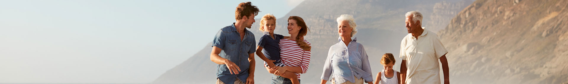 Multi-generational family walking outdoors.