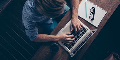 Man researching emergency loans online.