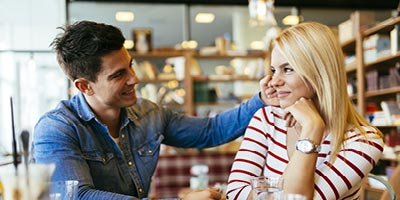 Man looking lovingly at his fiancee.