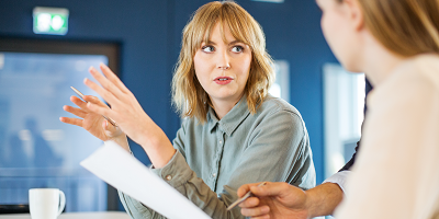 Woman talking to a female coworker