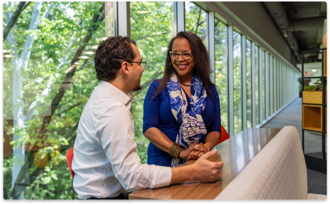 Man and woman Protective teammates collaborating at Protective Life office.