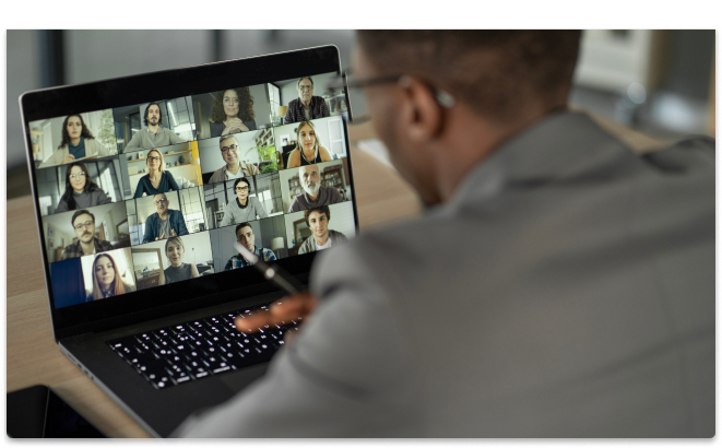 A remote teammate working on his laptop from his home office.