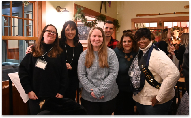 Diverse group of Protective employees working together at voluntary peer-led event.