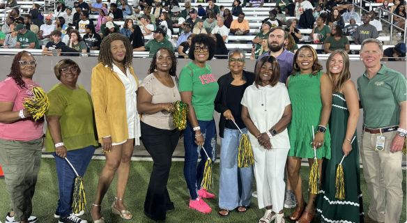Most Valuable Protectors pose for a picture at a UAB home football game.