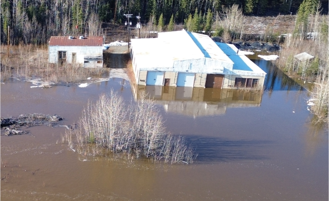 Budlings and road underwater due to flooding.