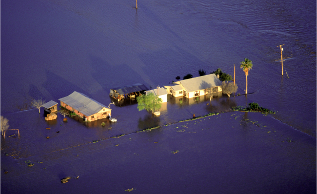 Budlings and road underwater due to flooding in Arizona.