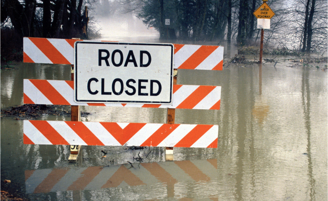 Road closed due to flooding.