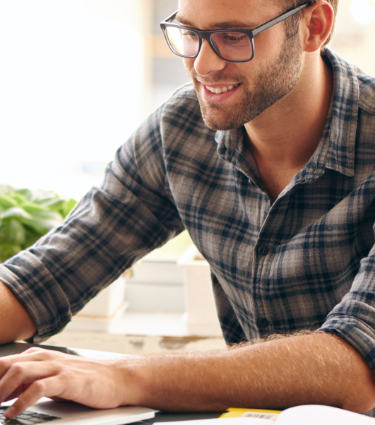 Young man using on a laptop