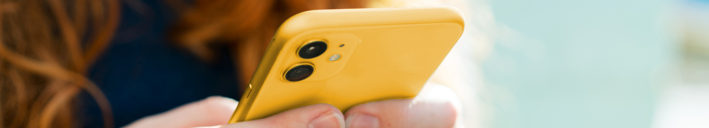 A customer checking her account information on her mobile phone.