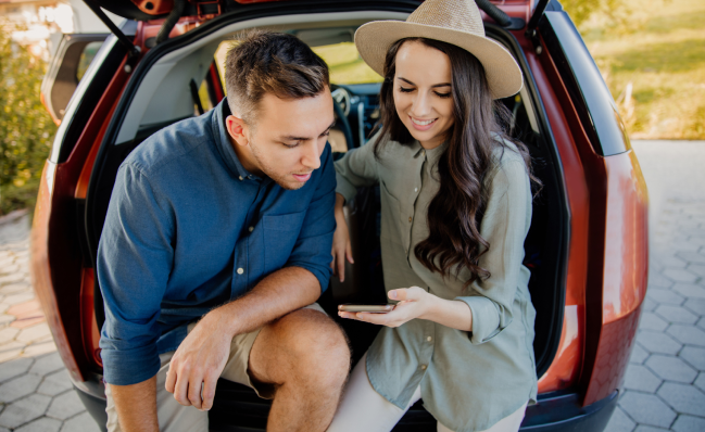 A young couple with peace of mind knowing they can manage their life insurance policy from anywhere.